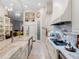 Spacious kitchen with white cabinets, granite countertops, and large island at 39851 & 39855 Darlington Ave, Lady Lake, FL 32159