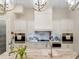 Gourmet kitchen with white cabinetry, granite counters, and high-end appliances at 39851 & 39855 Darlington Ave, Lady Lake, FL 32159