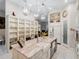 Island kitchen with white cabinets, granite countertops, and built-in shelving at 39851 & 39855 Darlington Ave, Lady Lake, FL 32159