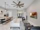Open concept living room and kitchen with white sofa and marble floors at 39851 & 39855 Darlington Ave, Lady Lake, FL 32159