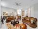 Spacious living room with elegant furnishings and a marble fireplace at 39851 & 39855 Darlington Ave, Lady Lake, FL 32159