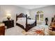 Luxurious main bedroom with a large four-poster bed and ample space at 39851 & 39855 Darlington Ave, Lady Lake, FL 32159