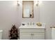 Stylish powder room with single vanity and ornate mirror at 39851 & 39855 Darlington Ave, Lady Lake, FL 32159