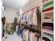 Large walk-in closet with custom shelving and hanging rods at 39851 & 39855 Darlington Ave, Lady Lake, FL 32159