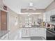 Eat-in kitchen with granite counters and bay window at 5416 Essex Ct, Leesburg, FL 34748