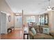 Light and airy entryway with hardwood floors and bench at 5416 Essex Ct, Leesburg, FL 34748