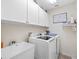 Laundry room with washer, dryer, and utility sink at 5416 Essex Ct, Leesburg, FL 34748