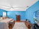 Bright bedroom with king-size bed, TV, and ample closet space at 5416 Essex Ct, Leesburg, FL 34748
