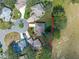 Aerial view of a house with a large yard, located in a residential neighborhood at 5416 Essex Ct, Leesburg, FL 34748