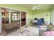 Enjoy a relaxing Florida room with seating and dining areas at 5416 Essex Ct, Leesburg, FL 34748