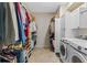 Convenient laundry room with washer, dryer, and ample storage at 5480 Bounty Cir, Tavares, FL 32778