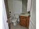 Bathroom with tub, toilet, and wood vanity at 652 Chelsea Dr, Davenport, FL 33897