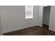 Bedroom with wood-look floors, window, and closet at 652 Chelsea Dr, Davenport, FL 33897