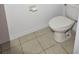 Simple bathroom with toilet and tile floor at 652 Chelsea Dr, Davenport, FL 33897