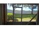 View of backyard through the screened porch at 652 Chelsea Dr, Davenport, FL 33897
