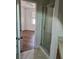 Bathroom with shower and view of bedroom at 652 Chelsea Dr, Davenport, FL 33897