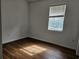 Bright bedroom with wood-look flooring and window blinds at 652 Chelsea Dr, Davenport, FL 33897