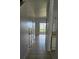 Bright hallway with tile floors and doors leading to other rooms at 652 Chelsea Dr, Davenport, FL 33897