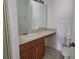 Bathroom with vanity, sink, and toilet at 652 Chelsea Dr, Davenport, FL 33897
