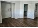 Bedroom with wood-look floors and closet at 652 Chelsea Dr, Davenport, FL 33897