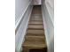 Indoor staircase with wood-look flooring at 652 Chelsea Dr, Davenport, FL 33897