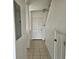 Clean hallway with tile floors and white walls at 652 Chelsea Dr, Davenport, FL 33897