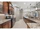 Spacious kitchen featuring granite countertops, stainless steel appliances, and ample cabinetry at 8420 Bridgeport Bay Cir, Mount Dora, FL 32757