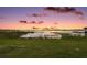 Scenic lake view with tranquil sunset and lush greenery at 9345 Silver Lake Dr, Leesburg, FL 34788