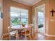 Breakfast nook with table and chairs near sliding door at 1010 Nantucket Sound, Mount Dora, FL 32757