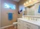 Clean bathroom with single vanity and updated fixtures at 1010 Nantucket Sound, Mount Dora, FL 32757