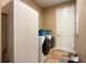 Convenient laundry room with washer, dryer, and extra storage at 1010 Nantucket Sound, Mount Dora, FL 32757