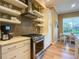 Modern kitchen with stainless steel appliances and a breakfast nook at 1010 Nantucket Sound, Mount Dora, FL 32757