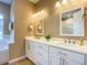 Elegant bathroom with double vanity and a large mirror at 1010 Nantucket Sound, Mount Dora, FL 32757