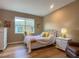 Cozy bedroom with a double bed, dresser and window at 1010 Nantucket Sound, Mount Dora, FL 32757
