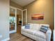 Office space with comfortable sofa and view into living area at 1010 Nantucket Sound, Mount Dora, FL 32757