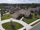 One-story home with a two-car garage and circular driveway at 1010 Nantucket Sound, Mount Dora, FL 32757