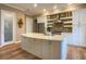 Open concept kitchen with a large island and white shaker cabinets at 1010 Nantucket Sound, Mount Dora, FL 32757
