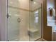 Spacious walk-in shower with glass enclosure and built-in seat at 1010 Nantucket Sound, Mount Dora, FL 32757