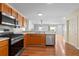 Kitchen with stainless steel appliances and wood cabinets at 17478 Se 77Th Sycamore Ave, The Villages, FL 32162