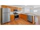 Modern kitchen featuring stainless steel appliances and wood cabinets at 17478 Se 77Th Sycamore Ave, The Villages, FL 32162