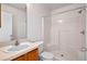 Clean bathroom with shower/tub combo and wood vanity at 17478 Se 77Th Sycamore Ave, The Villages, FL 32162