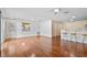 Spacious living room featuring hardwood floors and lots of natural light at 17478 Se 77Th Sycamore Ave, The Villages, FL 32162