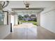Attached garage with open door, offering a view of the community at 17478 Se 77Th Sycamore Ave, The Villages, FL 32162