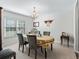 Dining room featuring a table with chairs and a yellow tablecloth at 17775 Se 125Th Cir, Summerfield, FL 34491