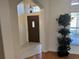 Spacious entryway with tiled floors and plants at 21630 King Henry Ave, Leesburg, FL 34748