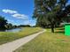 Landscaped golf course with pond and walking path at 21630 King Henry Ave, Leesburg, FL 34748