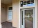 Front entrance with glass door and sidelights at 21630 King Henry Ave, Leesburg, FL 34748