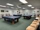 Room with multiple pool tables and seating at 21630 King Henry Ave, Leesburg, FL 34748