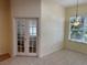 Breakfast nook with French doors leading to a bedroom at 21630 King Henry Ave, Leesburg, FL 34748