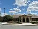 Community clubhouse with a well-manicured landscape at 21630 King Henry Ave, Leesburg, FL 34748